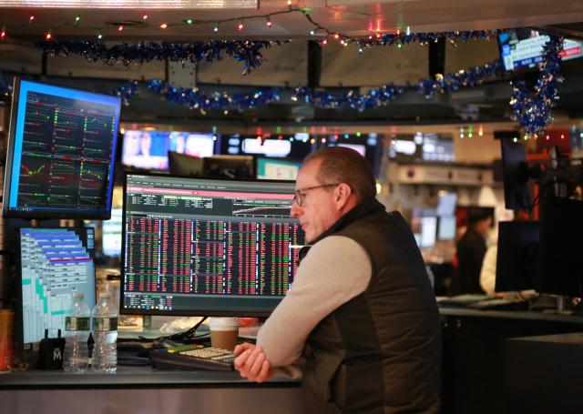 (251212) -- NEW YORK, Dec. 12, 2025 (Xinhua) -- A trader works on the floor of the New York Stock Exchange in New York, the United States, on Dec. 12, 2025. U.S. stocks ended lower on Friday. The Dow Jones Industrial Average fell by 245.96 points, or 0.51 percent, to 48,458.05. The S&P 500 sank 73.59 points, or 1.07 percent, to 6,827.41. The Nasdaq Composite Index shed 398.69 points, or 1.69 percent, to 23,195.17. (Xinhua/Liu Yanan)