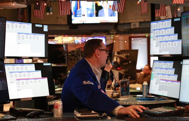 (251212) -- NEW YORK, Dec. 12, 2025 (Xinhua) -- A trader works on the floor of the New York Stock Exchange in New York, the United States, on Dec. 12, 2025. U.S. stocks ended lower on Friday. The Dow Jones Industrial Average fell by 245.96 points, or 0.51 percent, to 48,458.05. The S&P 500 sank 73.59 points, or 1.07 percent, to 6,827.41. The Nasdaq Composite Index shed 398.69 points, or 1.69 percent, to 23,195.17. (Xinhua/Liu Yanan)