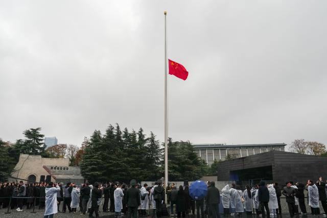 (251213) -- NANJING, Dec. 13, 2025 (Xinhua) -- China's national flag flies at half mast at the Memorial Hall of the Victims in Nanjing Massacre by Japanese Invaders in Nanjing, capital of east China's Jiangsu Province, Dec. 13, 2025. Saturday marks the 12th national memorial ceremony for the Nanjing Massacre victims. (Xinhua/Li Bo)