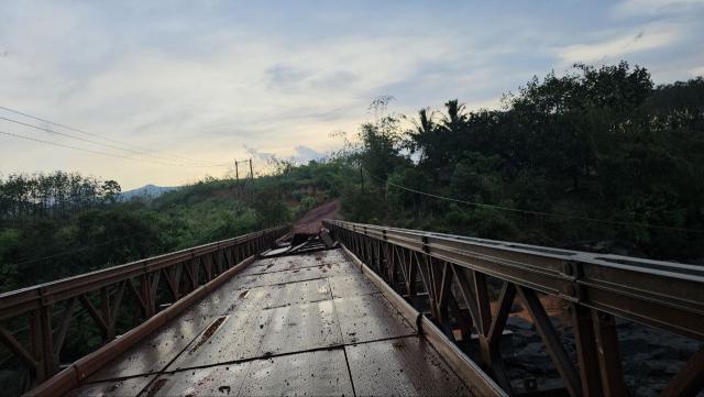 (251213) -- PURSAT, Dec. 13, 2025 (Xinhua) -- A bridge damaged during airstrikes by Thai military forces is seen in Pursat province, Cambodia, Dec. 13, 2025. The Thai military forces on Saturday morning used two F-16 fighter jets to drop bombs at some locations in Cambodia's Pursat province, the Cambodian defense ministry said in a press release. (Cambodian Defense Ministry/Handout via Xinhua)
