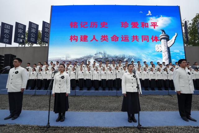 (251213) -- NANJING, Dec. 13, 2025 (Xinhua) -- A national memorial ceremony for the Nanjing Massacre victims is held at the Memorial Hall of the Victims in Nanjing Massacre by Japanese Invaders in Nanjing, capital of east China's Jiangsu Province, Dec. 13, 2025. The 12th national memorial day was observed in Nanjing on Saturday to honor about 300,000 victims killed by Japanese troops during the Nanjing Massacre, in a year that marks the 80th anniversary of the end of World War II (WWII). (Xinhua/Li Bo)