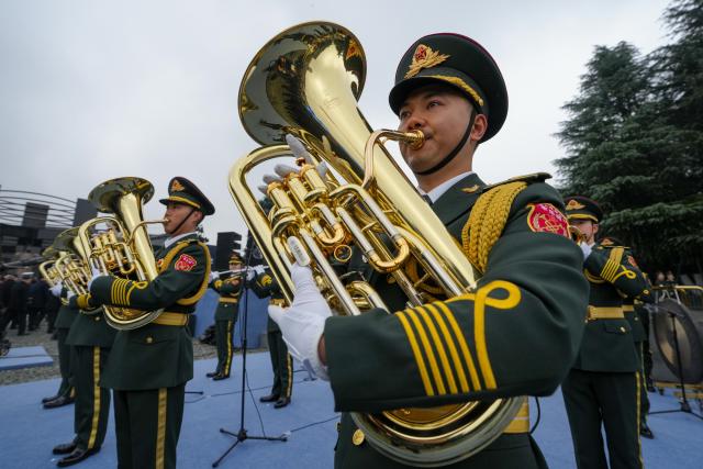 (251213) -- NANJING, Dec. 13, 2025 (Xinhua) -- A national memorial ceremony for the Nanjing Massacre victims is held at the Memorial Hall of the Victims in Nanjing Massacre by Japanese Invaders in Nanjing, capital of east China's Jiangsu Province, Dec. 13, 2025. The 12th national memorial day was observed in Nanjing on Saturday to honor about 300,000 victims killed by Japanese troops during the Nanjing Massacre, in a year that marks the 80th anniversary of the end of World War II (WWII). (Xinhua/Li Bo)