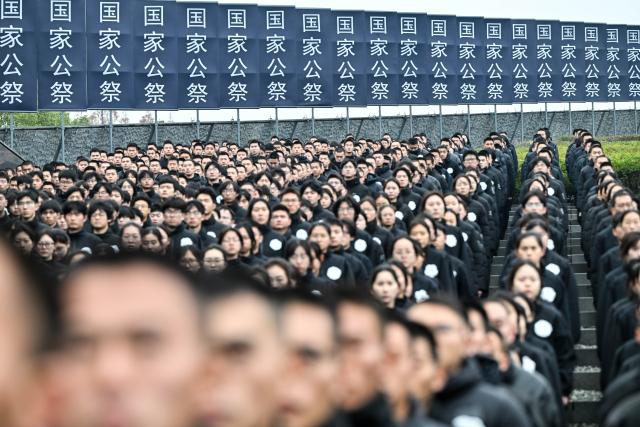 (251213) -- NANJING, Dec. 13, 2025 (Xinhua) -- A national memorial ceremony for the Nanjing Massacre victims is held at the Memorial Hall of the Victims in Nanjing Massacre by Japanese Invaders in Nanjing, capital of east China's Jiangsu Province, Dec. 13, 2025. The 12th national memorial day was observed in Nanjing on Saturday to honor about 300,000 victims killed by Japanese troops during the Nanjing Massacre, in a year that marks the 80th anniversary of the end of World War II (WWII). (Xinhua/Ji Chunpeng)