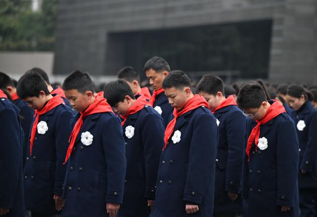 (251213) -- NANJING, Dec. 13, 2025 (Xinhua) -- A national memorial ceremony for the Nanjing Massacre victims is held at the Memorial Hall of the Victims in Nanjing Massacre by Japanese Invaders in Nanjing, capital of east China's Jiangsu Province, Dec. 13, 2025. The 12th national memorial day was observed in Nanjing on Saturday to honor about 300,000 victims killed by Japanese troops during the Nanjing Massacre, in a year that marks the 80th anniversary of the end of World War II (WWII). (Xinhua/Li Xiang)