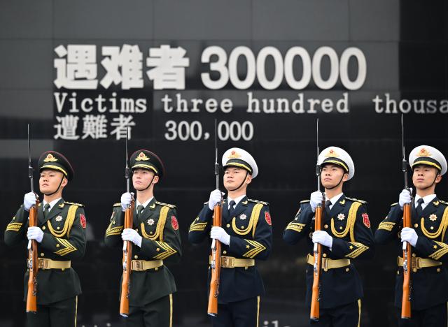 (251213) -- NANJING, Dec. 13, 2025 (Xinhua) -- A national memorial ceremony for the Nanjing Massacre victims is held at the Memorial Hall of the Victims in Nanjing Massacre by Japanese Invaders in Nanjing, capital of east China's Jiangsu Province, Dec. 13, 2025. The 12th national memorial day was observed in Nanjing on Saturday to honor about 300,000 victims killed by Japanese troops during the Nanjing Massacre, in a year that marks the 80th anniversary of the end of World War II (WWII). (Xinhua/Li Xiang)