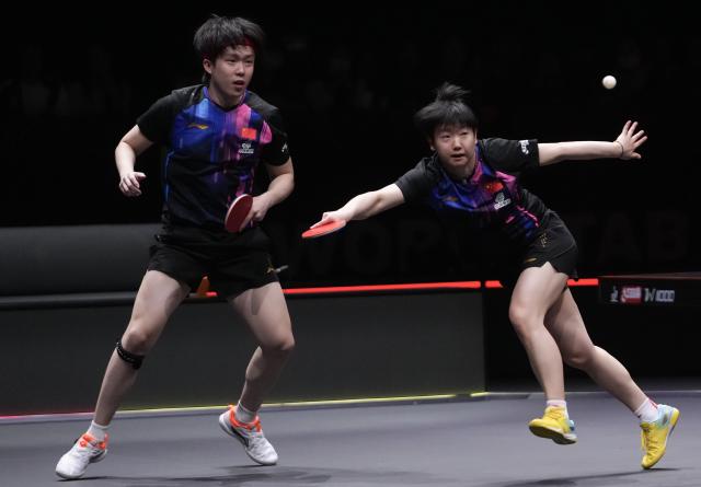 (251213) -- HONG KONG, Dec. 13, 2025 (Xinhua) -- Wang Chuqin/Sun Yingsha (R) of China compete during the mixed doubles quarterfianl match between Wang Chuqin/Sun Yingsha of China and Matsushima Sora/Harimoto Miwa of Japan at the WTT Finals Hong Kong 2025 in Hong Kong, south China, Dec. 13, 2025. (Xinhua/Lui Siu Wai)