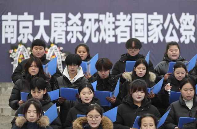 (251213) -- BEIJING, Dec. 13, 2025 (Xinhua) -- A memorial ceremony for the Nanjing Massacre victims is held at the Pingdingshan Massacre Memorial Hall in Fushun, northeast China's Liaoning Province, Dec. 13, 2025. The 12th national memorial day was observed on Saturday across the country to honor about 300,000 victims killed by Japanese troops during the Nanjing Massacre, in a year that marks the 80th anniversary of the end of World War II (WWII). (Xinhua/Li Gang)