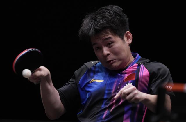 (251213) -- HONG KONG, Dec. 13, 2025 (Xinhua) -- Lin Shidong competes during the men's singles quarterfianl match between Lin Shidong of China and Xiang Peng of China at the WTT Finals Hong Kong 2025 in Hong Kong, south China, Dec. 13, 2025. (Xinhua/Lui Siu Wai)