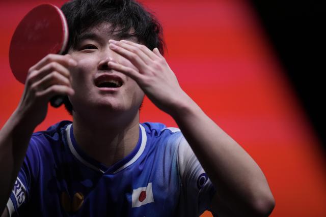 (251213) -- HONG KONG, Dec. 13, 2025 (Xinhua) -- Harimoto Tomokazu celebrates after the men's singles quarterfianl match between Harimoto Tomokazu of Japan and Felix Lebrun of France at the WTT Finals Hong Kong 2025 in Hong Kong, south China, Dec. 13, 2025. (Xinhua/Lui Siu Wai)