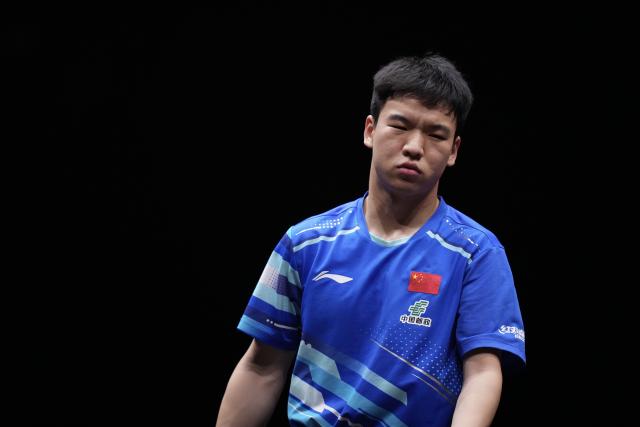 (251213) -- HONG KONG, Dec. 13, 2025 (Xinhua) -- Xiang Peng reacts during the men's singles quarterfianl match between Lin Shidong of China and Xiang Peng of China at the WTT Finals Hong Kong 2025 in Hong Kong, south China, Dec. 13, 2025. (Xinhua/Lui Siu Wai)