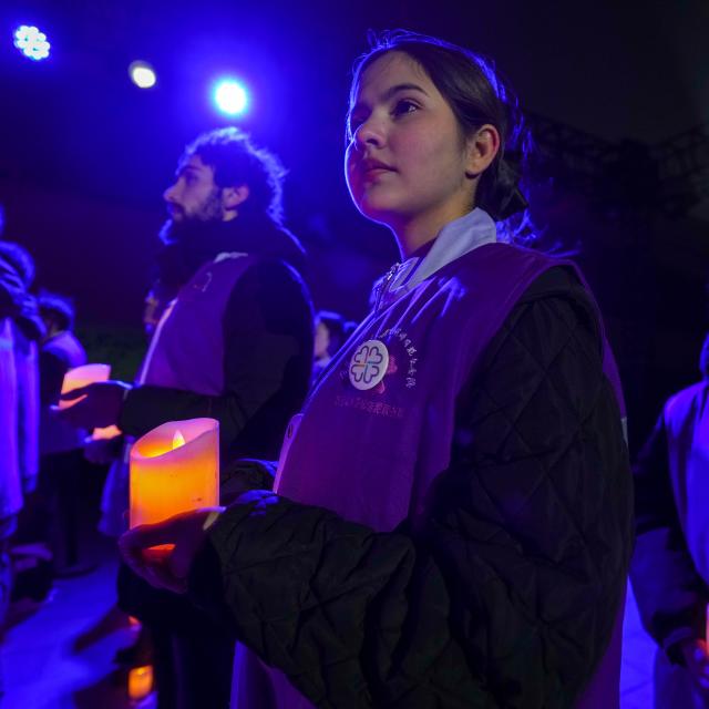 (251213) -- NANJING, Dec. 13, 2025 (Xinhua) -- People attend a candle-light vigil at the Memorial Hall of the Victims in Nanjing Massacre by Japanese Invaders in Nanjing, capital of east China's Jiangsu Province, Dec. 13, 2025. A candle-light vigil was held at the memorial hall on Saturday, which was the 12th national memorial day for the victims of the Nanjing Massacre. (Xinhua/Li Bo)