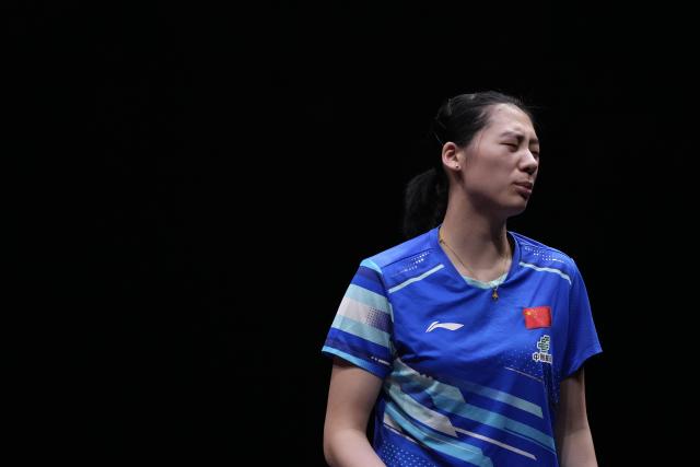 (251213) -- HONG KONG, Dec. 13, 2025 (Xinhua) -- Chen Yi reacts during the women's singles semifinal match between Wang Manyu of China and Chen Yi of China at the WTT Finals Hong Kong 2025 in Hong Kong, south China, Dec. 13, 2025. (Xinhua/Lui Siu Wai)