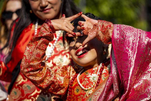 (251213) -- LALITPUR, Dec. 13, 2025 (Xinhua) -- A girl worships the Sun during a puberty ceremony known as Gufa in Lalitpur, Nepal, on Dec. 13, 2025. (Photo by Hari Maharjan/Xinhua)