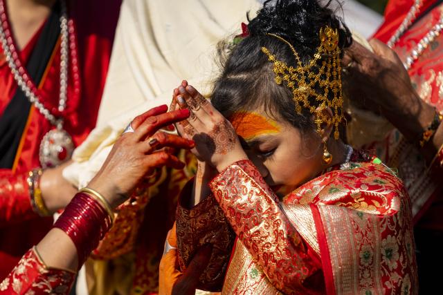 (251213) -- LALITPUR, Dec. 13, 2025 (Xinhua) -- A girl participates in a puberty ceremony known as Gufa in Lalitpur, Nepal, on Dec. 13, 2025. (Photo by Hari Maharjan/Xinhua)
