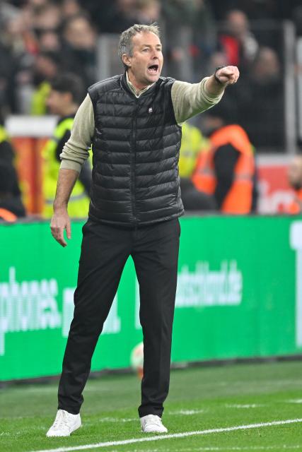 (251214) -- LEVERKUSEN, Dec. 14, 2025 (Xinhua) -- Bayer 04 Leverkusen's head coach Kasper Hjulmand instructs during the German first division of Bundesliga football match between Bayer 04 Leverkusen and FC Cologne in Leverkusen, Germany, Dec. 13, 2025. (Photo by Ulrich Hufnagel/Xinhua)
