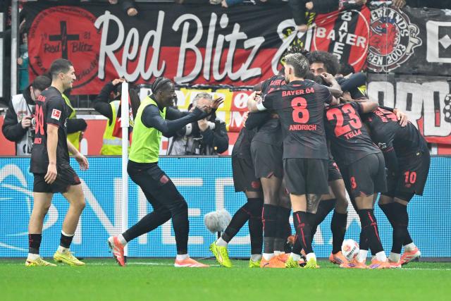 (251214) -- LEVERKUSEN, Dec. 14, 2025 (Xinhua) -- Players of Bayer 04 Leverkusen celebrate scoring during the German first division of Bundesliga football match between Bayer 04 Leverkusen and FC Cologne in Leverkusen, Germany, Dec. 13, 2025. (Photo by Ulrich Hufnagel/Xinhua)