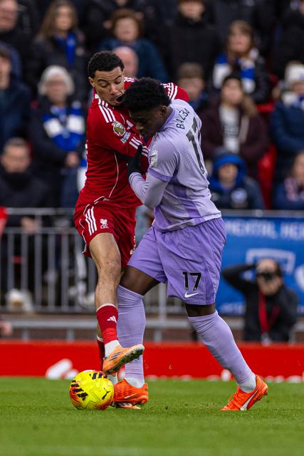 (251214) -- LIVERPOOL, Dec. 14, 2025 (Xinhua) -- Liverpool's Hugo Ekitike (L) is challenged by Brighton & Hove Albion's Carlos Baleba during the English Premier League match between Liverpool FC and Brighton & Hove Albion FC in Liverpool, Britain, on Dec. 13, 2025.  
FOR EDITORIAL USE ONLY. NOT FOR SALE FOR MARKETING OR ADVERTISING CAMPAIGNS. NO USE WITH UNAUTHORIZED AUDIO, VIDEO, DATA, FIXTURE LISTS, CLUB/LEAGUE LOGOS OR "LIVE" SERVICES. ONLINE IN-MATCH USE LIMITED TO 45 IMAGES, NO VIDEO EMULATION. NO USE IN BETTING, GAMES OR SINGLE CLUB/LEAGUE/PLAYER PUBLICATIONS. (Xinhua)