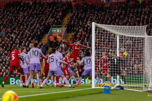 (251214) -- LIVERPOOL, Dec. 14, 2025 (Xinhua) -- Liverpool's Hugo Ekitike (top) scores the second goal during the English Premier League match between Liverpool FC and Brighton & Hove Albion FC in Liverpool, Britain, on Dec. 13, 2025.  
FOR EDITORIAL USE ONLY. NOT FOR SALE FOR MARKETING OR ADVERTISING CAMPAIGNS. NO USE WITH UNAUTHORIZED AUDIO, VIDEO, DATA, FIXTURE LISTS, CLUB/LEAGUE LOGOS OR "LIVE" SERVICES. ONLINE IN-MATCH USE LIMITED TO 45 IMAGES, NO VIDEO EMULATION. NO USE IN BETTING, GAMES OR SINGLE CLUB/LEAGUE/PLAYER PUBLICATIONS. (Xinhua)