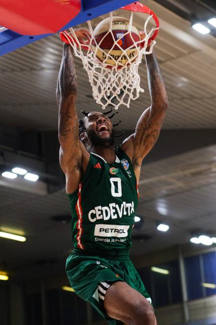 (251214) -- LJUBLJANA, Dec. 14, 2025 (Xinhua) -- DJ Stewart of Cedevita Olimpija dunks during the 10th round match between Cedevita Olimpija and Bosna BH Telekom at the AdmiralBet ABA Basketball League 2025/26 in Ljubljana, Slovenia, Dec. 13, 2025. (Photo by Zeljko Stevanic/Xinhua)