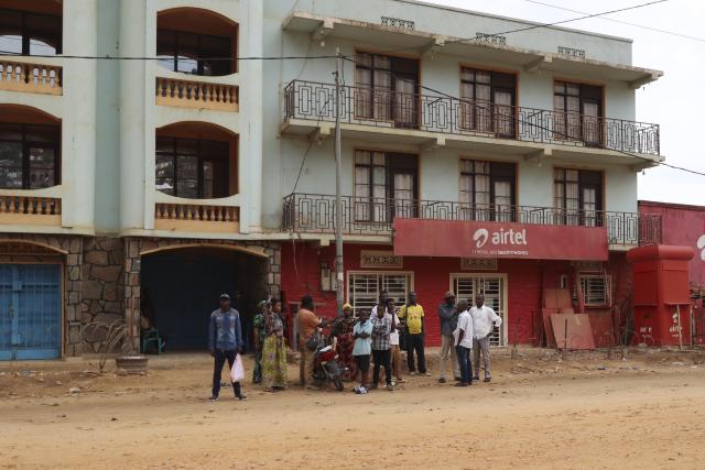 (251214) -- UVIRA, Dec. 14, 2025 (Xinhua) -- Locals are pictured in downtown Uvira city, eastern Democratic Republic of the Congo (DRC), Dec. 12, 2025.
  TO GO WITH "Feature: In eastern DR Congo's Uvira, war scars linger as calm cautiously returns" (Str/Xinhua)