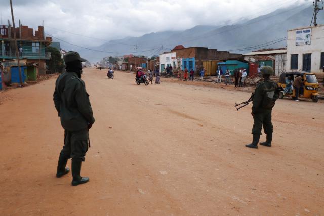(251214) -- UVIRA, Dec. 14, 2025 (Xinhua) -- Members of the March 23 Movement (M23) stand guard in Uvira city, eastern Democratic Republic of the Congo (DRC), Dec. 12, 2025.
  TO GO WITH "Feature: In eastern DR Congo's Uvira, war scars linger as calm cautiously returns" (Str/Xinhua)