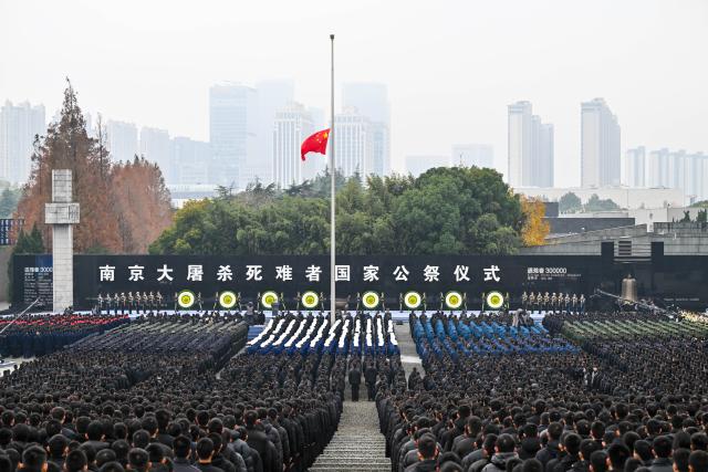 (251214) -- BEIJING, Dec. 14, 2025 (Xinhua) -- A national memorial ceremony for the Nanjing Massacre victims is held at the Memorial Hall of the Victims in Nanjing Massacre by Japanese Invaders in Nanjing, capital of east China's Jiangsu Province, Dec. 13, 2025.
  The 12th national memorial day was observed in Nanjing on Saturday to honor about 300,000 victims killed by Japanese troops during the Nanjing Massacre, in a year that marks the 80th anniversary of the end of World War II (WWII). (Xinhua/Ji Chunpeng)