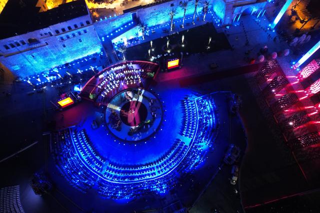 (251214) -- BEIJING, Dec. 14, 2025 (Xinhua) -- An aerial drone photo shows a performance celebrating the reopening of National Museum in Tripoli, Libya, Dec. 12, 2025.
  Libya on Friday celebrated the reopening of its national museum, housed within the historic Red Castle complex in Tripoli, marking a significant cultural moment after 14 years of closure following the 2011 popular uprising that toppled the rule of Muammar Gaddafi. (Photo by Hazem Turkia/Xinhua)