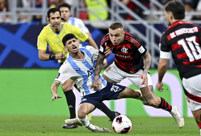 (251214) -- DOHA, Dec. 14, 2025 (Xinhua) -- Everton (2nd R) of CR Flamengo vies with Ahmed Atef (3rd R) of Pyramids FC during the FIFA Challenger Cup 2025 match between Brazil's CR Flamengo and Egypt's Pyramids FC, part of the FIFA Intercontinental Cup 2025 in Doha, Qatar, on Dec. 13, 2025. (Photo by Nikku/Xinhua)