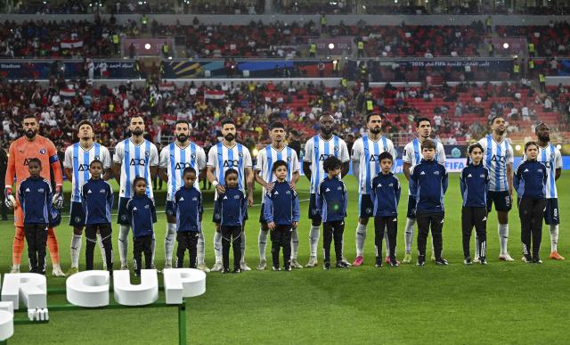(251214) -- DOHA, Dec. 14, 2025 (Xinhua) -- Starting players of Pyramids FC line up prior to the FIFA Challenger Cup 2025 match between Brazil's CR Flamengo and Egypt's Pyramids FC, part of the FIFA Intercontinental Cup 2025 in Doha, Qatar, on Dec. 13, 2025. (Photo by Nikku/Xinhua)