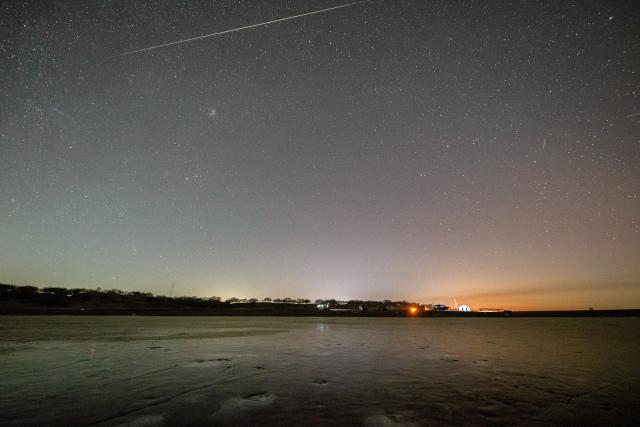 (251214) -- HARBIN, Dec. 14, 2025 (Xinhua) -- This photo taken on Dec. 13, 2025 shows the Geminid meteor shower in the sky over Daqing City, northeast China's Heilongjiang Province. The Geminid meteor shower, one of the most spectacular meteor showers of the year, reached its peak on Sunday. (Photo by Liu Wei/Xinhua)