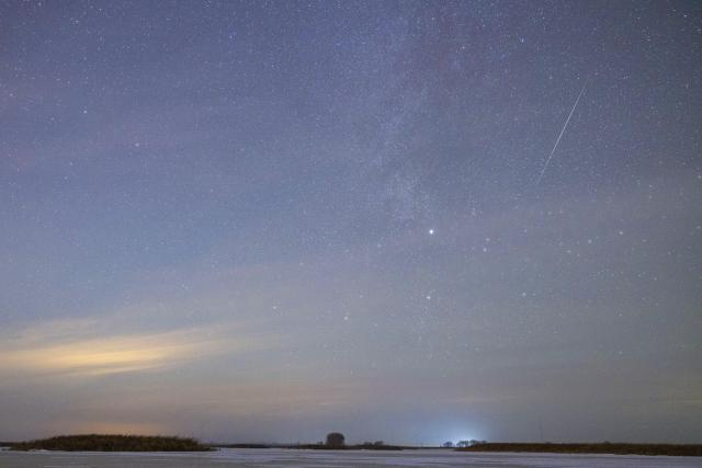 (251214) -- HARBIN, Dec. 14, 2025 (Xinhua) -- This photo taken on Dec. 13, 2025 shows the Geminid meteor shower in the sky over Shuangyashan City, northeast China's Heilongjiang Province. The Geminid meteor shower, one of the most spectacular meteor showers of the year, reached its peak on Sunday. (Photo by Han Yang/Xinhua)