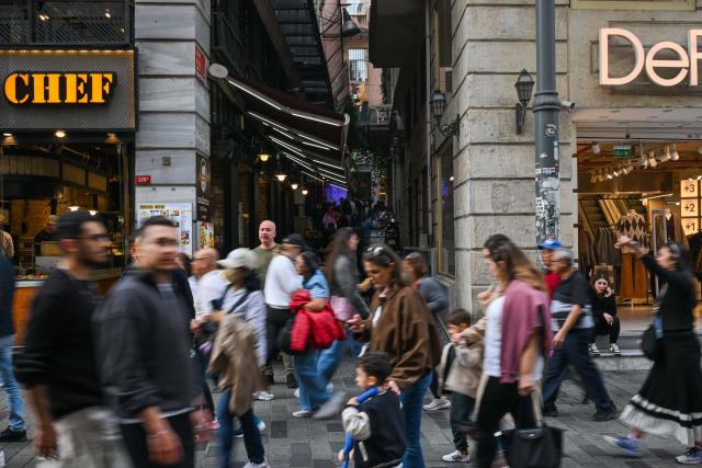 (251214) -- ISTANBUL, Dec. 14, 2025 (Xinhua) -- This photo taken on Nov. 22, 2025 shows the entrance of an alley where the Turkish cafe Mandabatmaz is located, at Istiklal Avenue in Istanbul, Türkiye.
  Mandabatmaz, a Turkish cafe, is located in a small alley beside Istiklal Avenue in Istanbul.
  The owner, Can Ozmen, took over this small coffee shop with a history of nearly sixty years from his parents. To carry on the tradition, he still insists on brewing coffee with copper pots. Ozmen introduced that Turkish coffee should be consumed with coffee grounds, which makes Turkish coffee unique. "Unlike other coffees, which are filtered, Turkish coffee is enjoyed in its entirety," Ozmen explained.
  Turkish coffee has a long history and was inscribed on UNESCO's Representative List of the Intangible Cultural Heritage of Humanity in 2013.
  While in China, a riverside cafe in Yunnan also wins fame among coffee lovers.
  Li Jinhe, 53, has operated his cafe in Mangkuan under Baoshan City in Gaoligong Mountains for 14 years.
  His "flame-brewed coffee", which made by a blowtorch to heat beneath siphon pots, has taken the Internet by storm for its originality, turning his cafe into a viral sensation.
  Tourists said that the coffee shop by the Nujiang River has broken the stereotype of urban coffee, and coffee should be a daily drink integrated into life.
  "I grew up here, and love Gaoligong Mountains," said Li. The Gaoligong Mountains, where fertile soil, ideal temperatures and abundant sunlight situate it within the global coffee-growing belt, boast small-bean coffee. "It is my unwavering commitment to promote local small-bean coffee," added Li.
  Although made by different ways, both Turkish and Chinese coffee tell the story of people's pursuit of life with warmth and aroma. (Xinhua/Liu Lei)