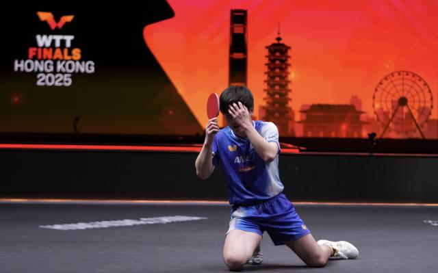 (251214) -- HONG KONG, Dec. 14, 2025 (Xinhua) -- Harimoto Tomokazu reacts after the men's singles final match between Harimoto Tomokazu of Japan and Truls Moregard of Sweden at the WTT Finals Hong Kong 2025 in Hong Kong, south China, Dec. 14, 2025. (Xinhua/Lui Siu Wai)