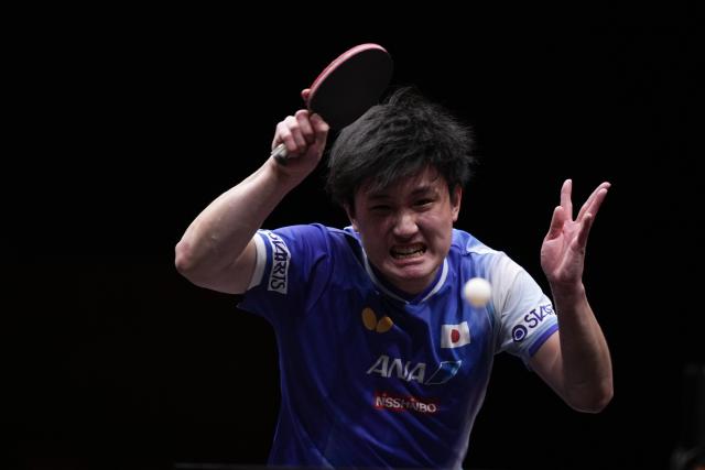 (251214) -- HONG KONG, Dec. 14, 2025 (Xinhua) -- Harimoto Tomokazu competes during the men's singles final match between Harimoto Tomokazu of Japan and Truls Moregard of Sweden at the WTT Finals Hong Kong 2025 in Hong Kong, south China, Dec. 14, 2025. (Xinhua/Lui Siu Wai)