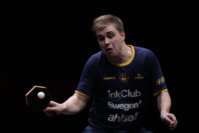 (251214) -- HONG KONG, Dec. 14, 2025 (Xinhua) -- Truls Moregard competes during the men's singles final match between Harimoto Tomokazu of Japan and Truls Moregard of Sweden at the WTT Finals Hong Kong 2025 in Hong Kong, south China, Dec. 14, 2025. (Xinhua/Lui Siu Wai)