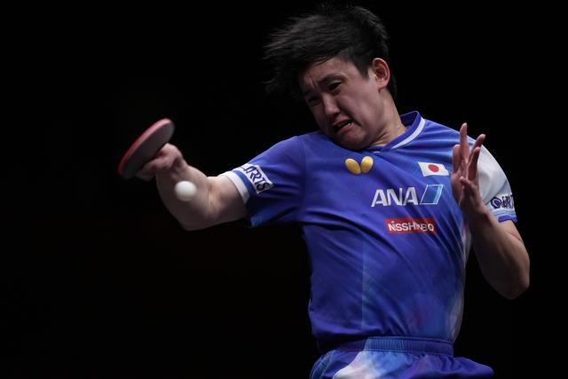 (251214) -- HONG KONG, Dec. 14, 2025 (Xinhua) -- Harimoto Tomokazu competes during the men's singles final match between Harimoto Tomokazu of Japan and Truls Moregard of Sweden at the WTT Finals Hong Kong 2025 in Hong Kong, south China, Dec. 14, 2025. (Xinhua/Lui Siu Wai)