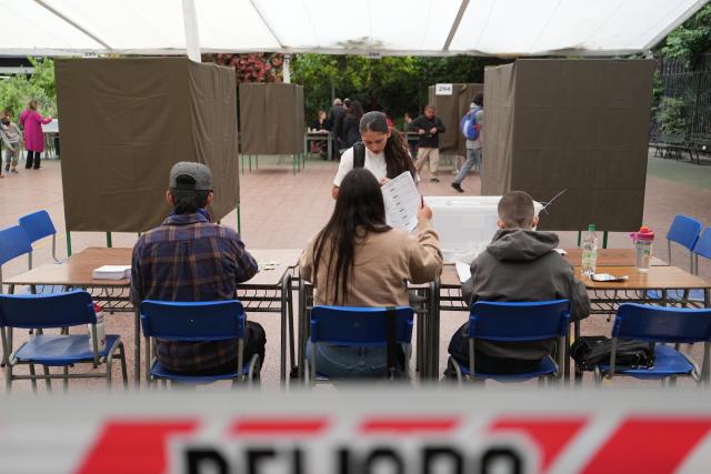 (251214) -- SANTIAGO, Dec. 14, 2025 (Xinhua) -- A local resident votes at a polling station in Santiago, Chile, Dec. 14, 2025. Voting in the Chilean presidential runoff election opened on Sunday, with leftist candidate Jeannette Jara and Republican contender Jose Antonio Kast competing in the runoff. (Xinhua/Zhang Duo)