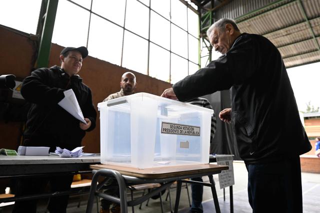 (251214) -- SANTIAGO, Dec. 14, 2025 (Xinhua) -- A local resident casts his vote at a polling station in Santiago, Chile, Dec. 14, 2025. Voting in the Chilean presidential runoff election opened on Sunday, with leftist candidate Jeannette Jara and Republican contender Jose Antonio Kast competing in the runoff. (Photo by Jorge Villegas/Xinhua)