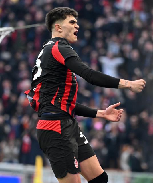 (251215) -- MILAN, Dec. 15, 2025 (Xinhua) -- AC Milan's Davide Bartesaghi celebrates his goal during a Serie A football match between AC Milan and Sassuolo in Milan, Italy, Dec. 14, 2025. (Photo by Alberto Lingria/Xinhua)