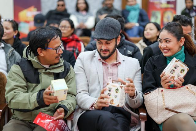 (251215) -- KATHMANDU, Dec. 15, 2025 (Xinhua) -- Attendees talk at the opening ceremony of the 2025 Himalayan Rim Regional Film Exhibition in Kathmandu, Nepal, Dec. 14, 2025.
  The 2025 Himalayan Rim Regional Film Exhibition commenced at Nepal's Tribhuvan University in Kathmandu on Sunday.
  Themed "Civilizational Mutual Learning, Technological Innovation," the event utilized a rich array of forms, including animated film screenings, craft workshops, cultural creative displays, and cinematic dialogues, to bring an audiovisual feast where traditional Chinese culture seamlessly blends with modern technology to young students.
  The eight-day touring exhibition, featuring four Chinese animation films, will also make stops at Kathmandu University and Lumbini Buddhist University. (Photo by Sulav Shrestha/Xinhua)