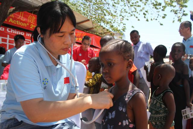 (251215) -- DAR ES SALAAM, Dec. 15, 2025 (Xinhua) -- A member of a Chinese medical team provides free clinical services at an orphanage in Dar es Salaam, Tanzania, on Dec. 13, 2025. Chinese medical teams in Tanzania mainland and Zanzibar offered free clinical services to children at two orphanages in Dar es Salaam over the weekend, as part of a China-Africa joint initiative to promote the well-being of orphans.
  TO GO WITH "Chinese medical teams provide free healthcare services to children at Dar es Salaam orphanages" (Xinhua/Emmanuel Herman)