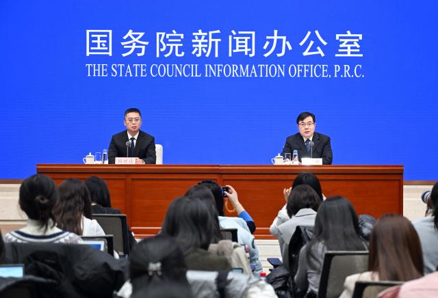 (251215) -- BEIJING, Dec. 15, 2025 (Xinhua) -- Fu Linghui (R), spokesperson and chief economist of the National Bureau of Statistics (NBS) and director general of the Department of Comprehensive Statistics of the NBS, attends a press conference held by the State Council Information Office (SCIO) on China's economic performance in November 2025, in Beijing, capital of China, Dec. 15, 2025. (Xinhua/Chen Yehua)