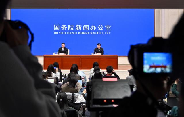(251215) -- BEIJING, Dec. 15, 2025 (Xinhua) -- Fu Linghui (R), spokesperson and chief economist of the National Bureau of Statistics (NBS) and director general of the Department of Comprehensive Statistics of the NBS, attends a press conference held by the State Council Information Office (SCIO) on China's economic performance in November 2025, in Beijing, capital of China, Dec. 15, 2025. (Xinhua/Chen Yehua)