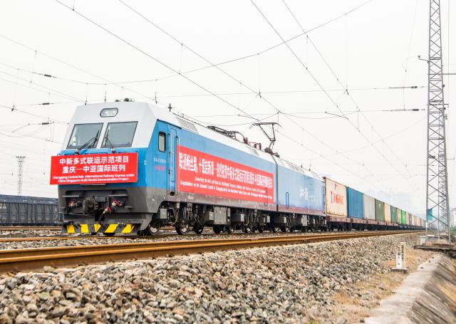 (251215) -- CHONGQING, Dec. 15, 2025 (Xinhua) -- A cargo train of the Chongqing-Central Asia International Railway Express under China-Singapore Multi-modal Demonstration Project is pictured before departure at the Yuzui Station in southwest China's Chongqing, Dec. 15, 2025.
  Two freight trains under China-Singapore Multi-modal Demonstration Project departed here on Monday, heading to Singapore via Chongqing-Southeast Asia Railway Express and Kazakhstan through Chongqing-Central Asia International Railway Express, respectively.
  The logistics routes connect China-Europe Railway Express and the New International Land-Sea Trade Corridor, creating a trade channel among western China, ASEAN and the Eurasian continent. (Xinhua/Tang Yi)