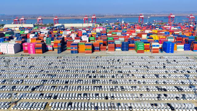 (251215) -- BEIJING, Dec. 15, 2025 (Xinhua) -- An aerial drone photo taken on Dec. 14, 2025 Chinese-made vehicles waiting for export at a container dock of Nanjing Port in Nanjing, east China's Jiangsu Province.
  China's economy has maintained steady momentum in November, creating favorable conditions to achieve the annual growth target, as revealed by the latest economic indicators on Monday.
  In November, the country's value-added industrial output expanded 4.8 percent year on year. In the first 11 months, the industrial output increased by 6 percent. (Photo by Yang Suping/Xinhua)