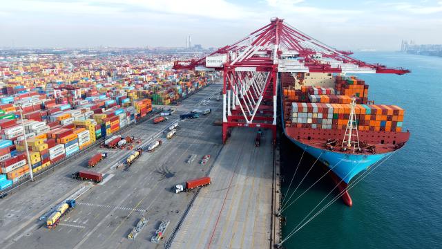 (251215) -- BEIJING, Dec. 15, 2025 (Xinhua) -- An aerial drone photo taken on Dec. 15, 2025 shows a cargo ship loading and unloading containers at Qingdao Port in Qingdao, east China's Shandong Province.
  China's economy has maintained steady momentum in November, creating favorable conditions to achieve the annual growth target, as revealed by the latest economic indicators on Monday.
  In November, the country's value-added industrial output expanded 4.8 percent year on year. In the first 11 months, the industrial output increased by 6 percent. (Photo by Yu Fangping/Xinhua)