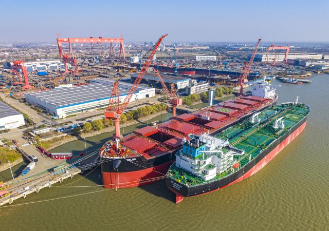 (251215) -- BEIJING, Dec. 15, 2025 (Xinhua) -- An aerial drone photo taken on Dec. 14, 2025 shows the production base of an ocean shipping heavy industry company in Jiangdu high-tech industrial development zone in east China's Jiangsu Province.
  China's economy has maintained steady momentum in November, creating favorable conditions to achieve the annual growth target, as revealed by the latest economic indicators on Monday.
  In November, the country's value-added industrial output expanded 4.8 percent year on year. In the first 11 months, the industrial output increased by 6 percent. (Photo by Ren Fei/Xinhua)