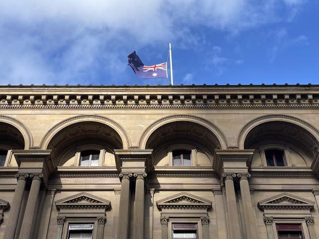 (251215) -- MELBOURNE, Dec. 15, 2025 (Xinhua) -- An Australian national flag flies at half-mast at the Old Treasury Building in Melbourne, Australia, Dec. 15, 2025.
  The death toll from a shooting at Sydney's Bondi Beach on Sunday has risen to 16, with a father and son identified as the attackers, police said Monday.
  The deceased range in age from 10 to 87 years old and includes one of the attackers.
   Another 40 people were being treated in hospital for their injuries as of Monday morning, five of whom were in critical condition. (Xinhua/Xu Haijing)