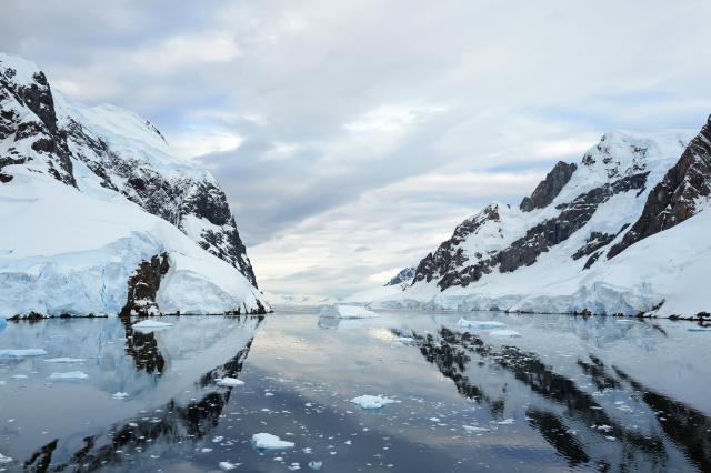 (251215) -- ANTARCTICA, Dec. 15, 2025 (Xinhua) -- This photo taken on Dec. 12, 2025 shows the Lemaire Channel in Antarctica. The Antarctic ice and snow melt in large quantities during the height of summer, when the weather is relatively mild and the days are long. It is not only the high season for penguins to mate and hatch their chicks, but also the best time for whale watching. (Photo by Yang Shu/Xinhua)