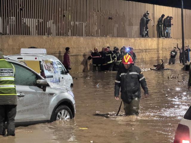 (251215) -- SAFI PROVINCE, Dec. 15, 2025 (Xinhua) -- Rescuers from the local security and civil defense department work in a flood-hit area in Safi province, Morocco, Dec. 14, 2025. At least 41 people were killed in flash floods caused by heavy rainfall in Morocco on Sunday, authorities said on Monday.
   In the Atlantic coastal province of Safi, local authorities said in a statement that the death toll had risen to 37, with 14 injured people receiving treatment at local hospitals.
   In the southern province of Tinghir, four people were killed after their vehicle was swept away by strong currents and overturned into a river between the areas of Fezou and El Hafira, local news outlet Hibapress reported. (Photo by Saouri Aissa/Xinhua)